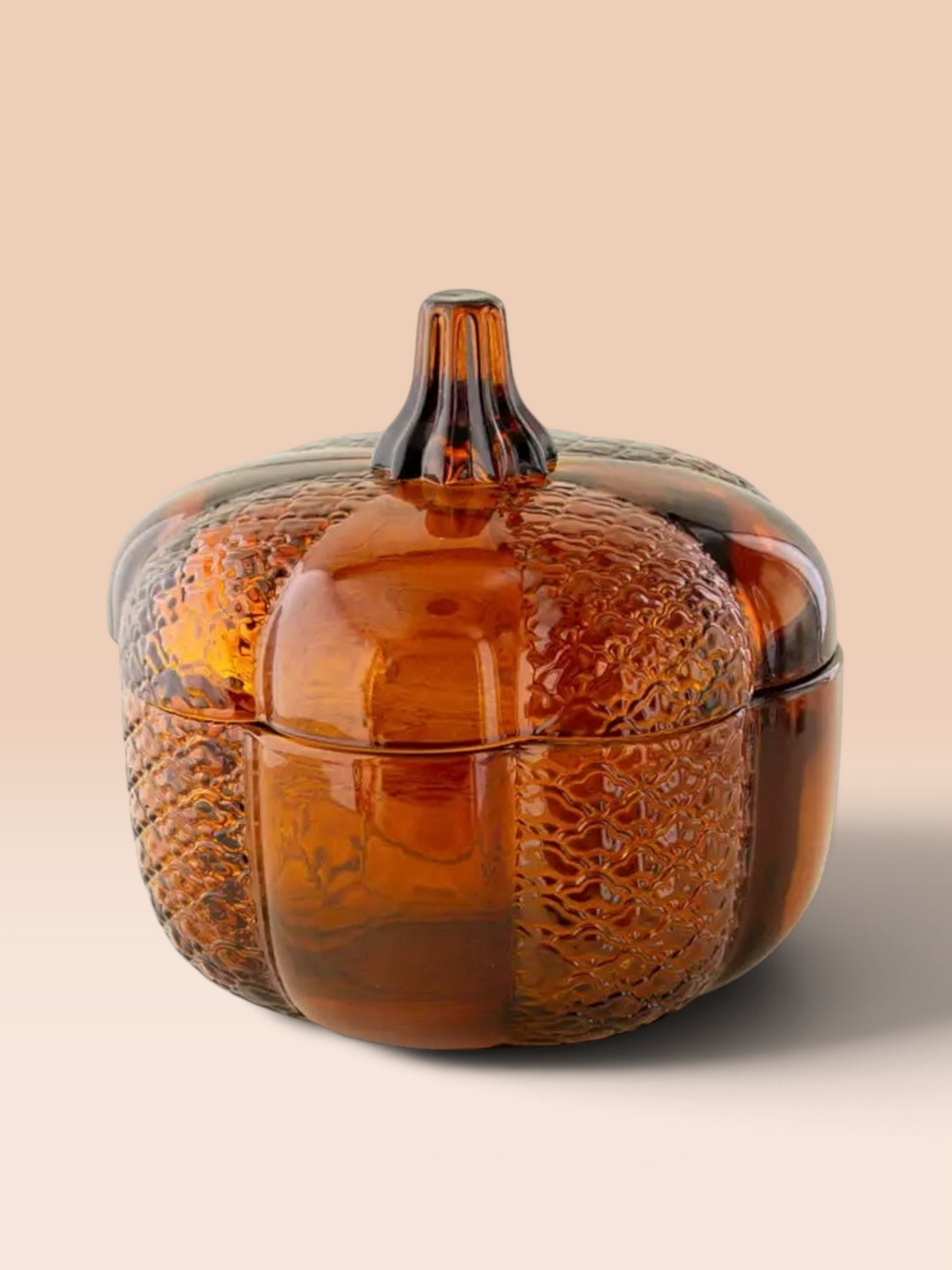 Grandeur Le Luxe amber glass pumpkin storage jar with textured embossed detailing and a removable lid.